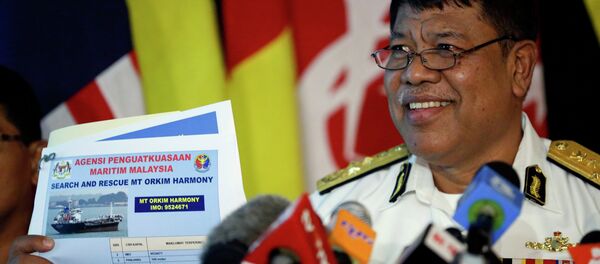 The deputy director of the Malaysian Maritime Enforcement Agency, Ahmad Puzi Abdul Kahar, show a picture of missing tanker during a press conference in Kuala Lumpur, Malaysia, June 15, 2015 The deputy director of the Malaysian Maritime Enforcement Agency, Ahmad Puzi Abdul Kahar, show a picture of missing tanker during a press conference in Kuala Lumpur, Malaysia, June 15, 2015 - Sputnik International