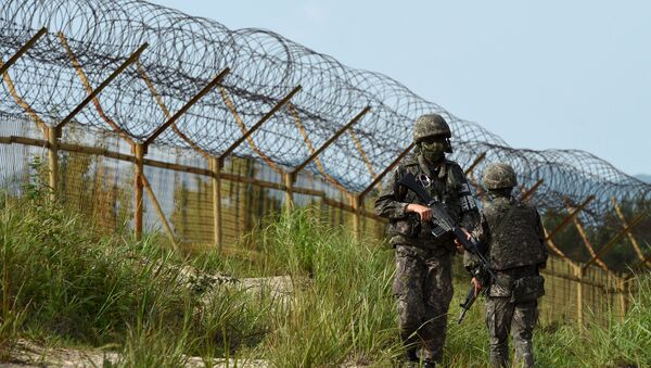 South Korean soldiers patrol along the scene of a blast inside the demilitarized zone separating the two Koreas in Paju, South Korea, in this picture taken on August 9, 2015  - Sputnik International