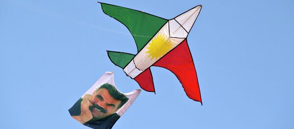 A kite in the colors of the Kurdish flag and with a photograph Abdullah Ocalan, the imprisoned leader of the Kurdistan Workers' Party (PKK) A kite in the colors of the Kurdish flag and with a photograph Abdullah Ocalan, the imprisoned leader of the Kurdistan Workers' Party (PKK) - Sputnik International