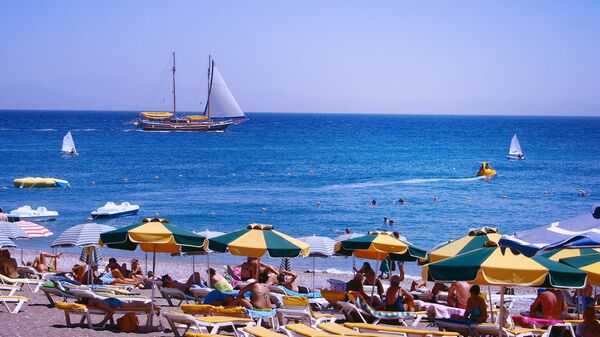 People sunbathing at Elli Beach, Rhodes, Greece. People sunbathing at Elli Beach, Rhodes, Greece. - Sputnik International