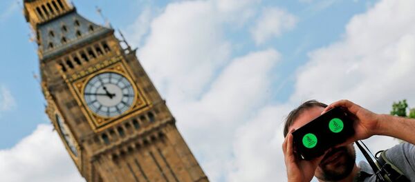 A man looks through a virtual reality device that shows a 360 degree view of the city of Aleppo, Syria during an Amnesty International protest in Parliament Square to urge the British government to do more to help Syrian refugees, London, Saturday, July 11, 2015. A man looks through a virtual reality device that shows a 360 degree view of the city of Aleppo, Syria during an Amnesty International protest in Parliament Square to urge the British government to do more to help Syrian refugees, London, Saturday, July 11, 2015. - Sputnik International