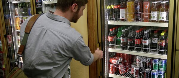 Ezra, last name not given, looks at the soft drink selection at K & D Market in San Francisco, Wednesday, Oct. 1, 2014 - Sputnik International