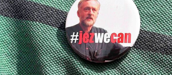 A supporter wears a campaign badge as British Labour Party politician Jeremy Corbyn arrives for a community meeting in north London August 9, 2015. - Sputnik International