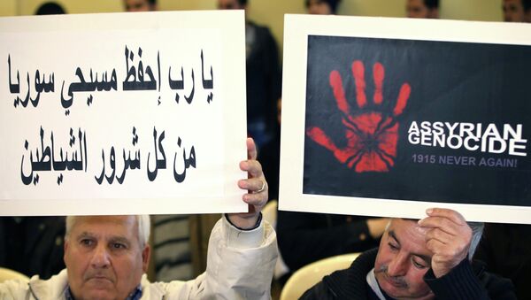 Assyrians citizens hold placards during a sit-in for abducted Christians in Syria and Iraq, at a church in Sabtiyesh area east Beirut, Lebanon, Thursday, Feb. 26, 2015 - Sputnik International