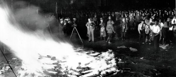 Flames roar high as a crowd gathers to witness thousands of books, considered to be un-German, burn in Opera Square in Berlin, Germany, during the Buecherverbrennung, book burnings on May 10, 1933. Flames roar high as a crowd gathers to witness thousands of books, considered to be un-German, burn in Opera Square in Berlin, Germany, during the Buecherverbrennung, book burnings on May 10, 1933. - Sputnik International