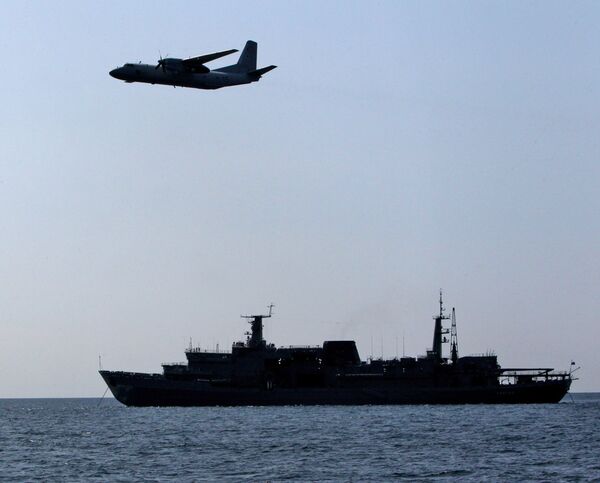 An-26 aircraft of thje Pacific Fleet conducts search of a recovery capsule. File photo - Sputnik International