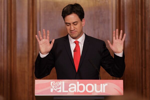 Britain's Labour Party leader Ed Miliband holds up his hands as he delivers his resignation at a press conference in Westminster, London, Friday, May 8, 2015 Britain's Labour Party leader Ed Miliband holds up his hands as he delivers his resignation at a press conference in Westminster, London, Friday, May 8, 2015 - Sputnik International