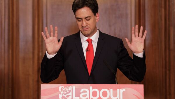 Britain's Labour Party leader Ed Miliband holds up his hands as he delivers his resignation at a press conference in Westminster, London, Friday, May 8, 2015 - Sputnik International