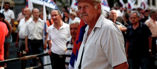 Supporters of the Communist-affiliated PAME labor union take part in an anti-austerity rally outside the Labor Ministry in Athens, Greece, on Wednesday, Aug. 5, 2015. Supporters of the Communist-affiliated PAME labor union take part in an anti-austerity rally outside the Labor Ministry in Athens, Greece, on Wednesday, Aug. 5, 2015. - Sputnik International