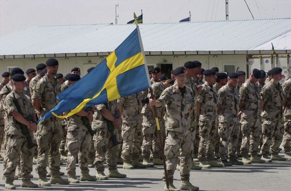 Swedish soldiers part of the International Security Assistant Force (ISAF) stand during a changing of command ceremony at the Swedish run Provincial Reconstruction Team in Mazar Sharif north of Kabul, Afghanistan on Tuesday May 6, 2008 - Sputnik International