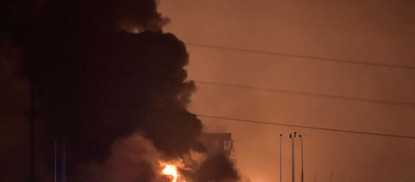 Smoke and fire rises after an explosion in the Binhai New Area in north China's Tianjin Municipality on Thursday Aug. 13, 2015. Smoke and fire rises after an explosion in the Binhai New Area in north China's Tianjin Municipality on Thursday Aug. 13, 2015. - Sputnik International