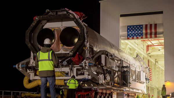 An Orbital Science Corporation Antares rocket is seen as it is rolled out to launch Pad-0A at NASA's Wallops Flight Facility Tuesday, December 17, 2013 in advance of a Thursday launch, Wallops Island, VA. - Sputnik International
