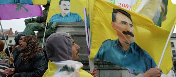 Demonstrators wave flags bearing pictures of jailed Kurdish rebel leader Abdullah Ocalan during a protest against the Turkish government in Brussels on July 28, 2015 Demonstrators wave flags bearing pictures of jailed Kurdish rebel leader Abdullah Ocalan during a protest against the Turkish government in Brussels on July 28, 2015 - Sputnik International