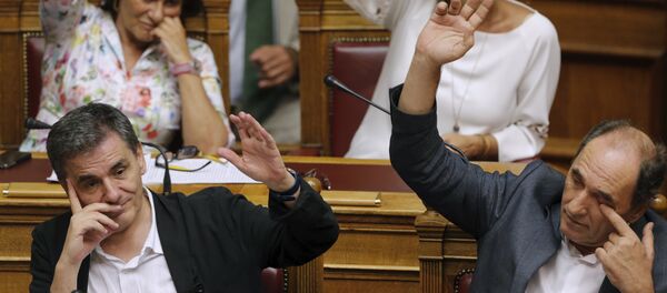 Greek Economy Minister Giorgos Stathakis (R) and Finance Minister Euclid Tsakalotos (L) attend a parliamentary session in Athens, Greece, early August 14, 2015 Greek Economy Minister Giorgos Stathakis (R) and Finance Minister Euclid Tsakalotos (L) attend a parliamentary session in Athens, Greece, early August 14, 2015 - Sputnik International