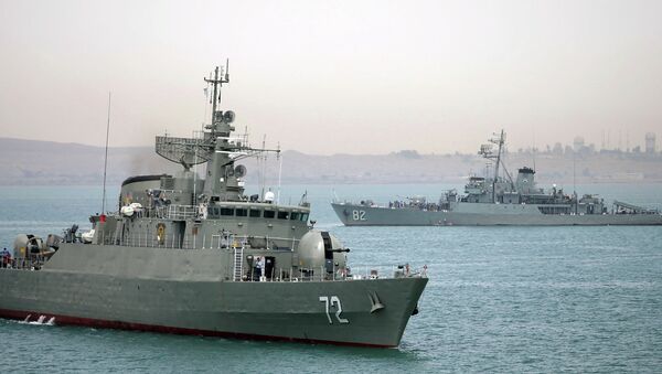 Iranian warship Alborz, foreground, prepares before leaving Iran's waters. - Sputnik International