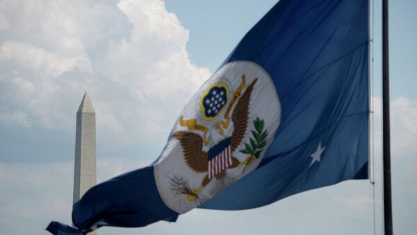The Washington Monument is seen beyond the US State Department's flag June 30, 2015 in Washington, DC - Sputnik International