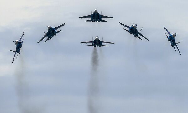 The performance of the Strizhi aerobatic team in MiG-29 jets during a show at the ARMY 2015 International Military-Technical Forum held outside Moscow The performance of the Strizhi aerobatic team in MiG-29 jets during a show at the ARMY 2015 International Military-Technical Forum held outside Moscow - Sputnik International