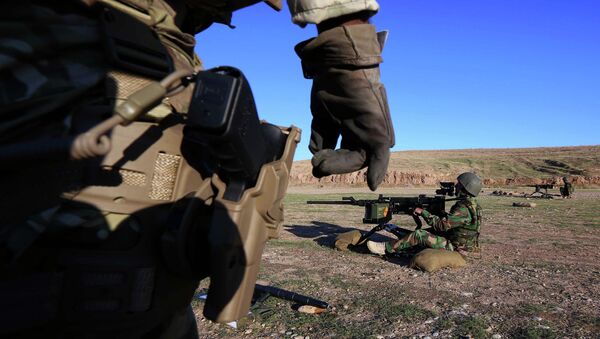 British military advisers instruct Kurdish Peshmerga fighters during a training session at a shooting range on the outskirts of Arbil, the capital of the autonomous Kurdish region of northern Iraq - Sputnik International