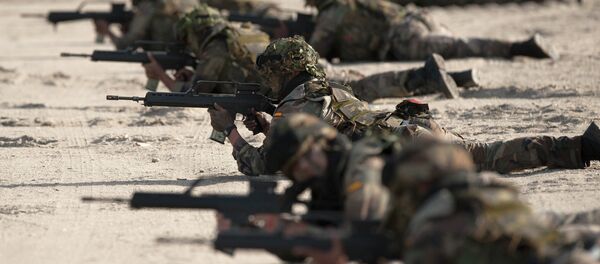 Spanish Navy Marines take positions during a military exercise in the Garrucha beach near Almeria, Spain. File photo Spanish Navy Marines take positions during a military exercise in the Garrucha beach near Almeria, Spain. File photo - Sputnik International