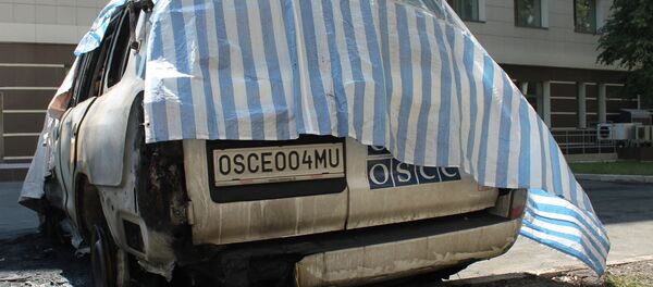 Six OSCE mission cars burned in Donetsk Six OSCE mission cars burned in Donetsk - Sputnik International