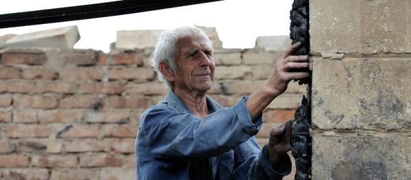 A man by his house, which was destroyed by a Ukrainian military artillery attack on Donetsk's Kuibyshevsky District A man by his house, which was destroyed by a Ukrainian military artillery attack on Donetsk's Kuibyshevsky District - Sputnik International