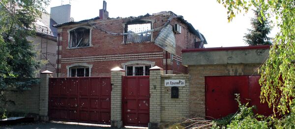 A building destroyed by shelling of the Oktyabrsky village in the Kuibyshevsky district of Donetsk - Sputnik International