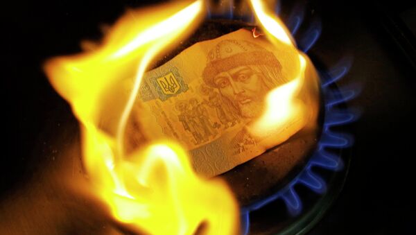 A burning one hryvnia bill on a gas burner - Sputnik International