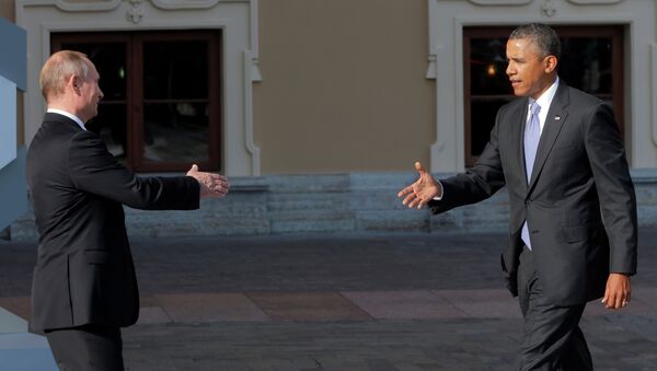Russia's President Vladimir Putin, left, reaches out to shake hands with U.S. President Barack Obama during arrivals for the G-20 summit at the Konstantin Palace in St. Petersburg, Russia on Thursday, Sept. 5, 2013 - Sputnik International