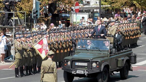 Polish President Andrzej Duda and Chief of Staff Gen. Mieczyslaw Gocul review troops prior to a military parade during Armed Forces Day in Warsaw, Poland August 15, 2015 - Sputnik International