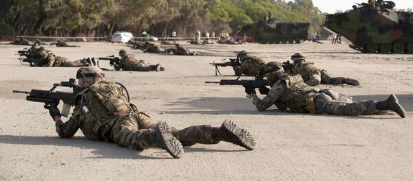 Spanish Navy Marines take position during a military exercise on the Garrucha beach near Almeria, Spain, Tuesday, Oct.21, 2014. NATO warships are exercising in the Mediterranean Sea and Atlantic Ocean as part of a NATO Response Force training to test its crisis response capabilities with over 23 warships Spanish Navy Marines take position during a military exercise on the Garrucha beach near Almeria, Spain, Tuesday, Oct.21, 2014. NATO warships are exercising in the Mediterranean Sea and Atlantic Ocean as part of a NATO Response Force training to test its crisis response capabilities with over 23 warships - Sputnik International