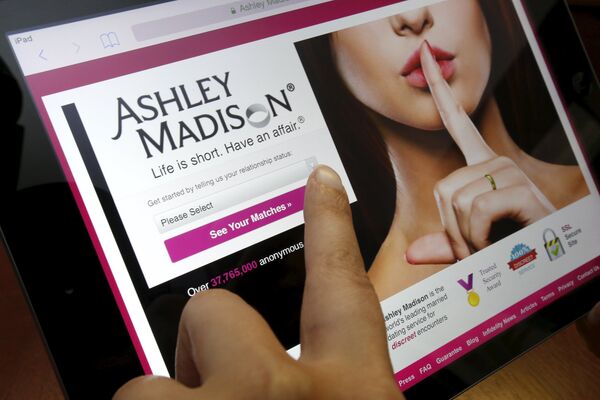 The homepage of the Ashley Madison website is displayed on an iPad, in this photo illustration taken in Ottawa, Canada July 21, 2015 The homepage of the Ashley Madison website is displayed on an iPad, in this photo illustration taken in Ottawa, Canada July 21, 2015 - Sputnik International
