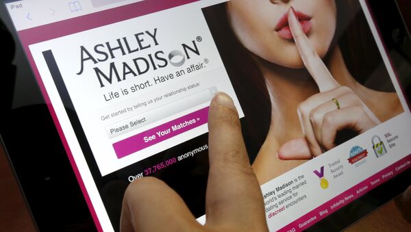 The homepage of the Ashley Madison website is displayed on an iPad, in this photo illustration taken in Ottawa, Canada July 21, 2015 - Sputnik International