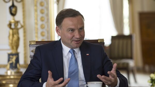 Poland's President Andrzej Duda gestures during a Reuters interview at the Presidential Palace in Warsaw, Poland August 14, 2015 - Sputnik International