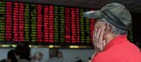 This photo taken on August 13, 2015 shows investors monitoring screens showing stock market movements at a brokerage house in Shanghai This photo taken on August 13, 2015 shows investors monitoring screens showing stock market movements at a brokerage house in Shanghai - Sputnik International