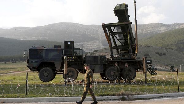 Soldiers of the German armed forces Bundeswehr stand next to the Patriot system before the arrival of Germany's Chancellor Angela Merkel at a Turkish military base in Kahramanmaras in this February 24, 2013 - Sputnik International