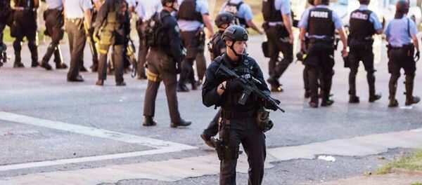 Police line up to block the street as protesters gathered after a shooting incident in St. Louis, Missouri August 19, 2015 Police line up to block the street as protesters gathered after a shooting incident in St. Louis, Missouri August 19, 2015 - Sputnik International