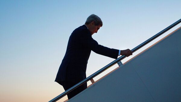 Secretary of State John Kerry walks up the stairs to boards his aircraft at Andrews Air Force Base, Md., August 14, 2015, for a flight to Havana, Cuba - Sputnik International