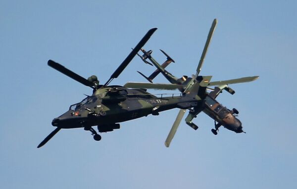 Eurocopter Tiger H61 helicopters perform their demonstration flight during the 50th Paris Air Show at Le Bourget airport, north of Paris, Thursday, June 20, 2013 Eurocopter Tiger H61 helicopters perform their demonstration flight during the 50th Paris Air Show at Le Bourget airport, north of Paris, Thursday, June 20, 2013 - Sputnik International