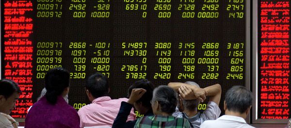 Investors monitor stock prices at a brokerage in Beijing, Friday, Aug. 21, 2015 Investors monitor stock prices at a brokerage in Beijing, Friday, Aug. 21, 2015 - Sputnik International