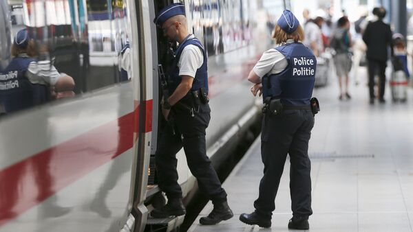 Belgian police officers enter a train during a patrol at the Thalys high-speed train terminal at Brussels Midi/Zuid railway station - Sputnik International