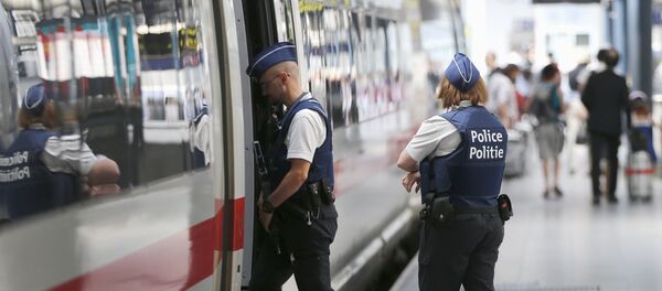 Belgian police officers enter a train during a patrol at the Thalys high-speed train terminal at Brussels Midi/Zuid railway station - Sputnik International