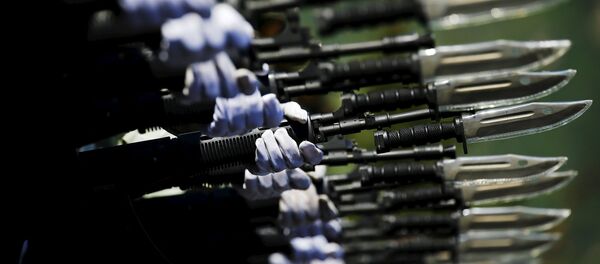Soldiers of China's People's Liberation Army march with their weapons during a training session for a military parade to mark the 70th anniversary of the end of World War Two, at a military base in Beijing, China, August 22, 2015 Soldiers of China's People's Liberation Army march with their weapons during a training session for a military parade to mark the 70th anniversary of the end of World War Two, at a military base in Beijing, China, August 22, 2015 - Sputnik International