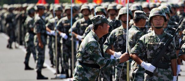 A Chinese soldier aligns troops with a string as they practice marching ahead of a Sept. 3 military parade at a camp on the outskirts of Beijing, Saturday, Aug. 22, 2015 A Chinese soldier aligns troops with a string as they practice marching ahead of a Sept. 3 military parade at a camp on the outskirts of Beijing, Saturday, Aug. 22, 2015 - Sputnik International