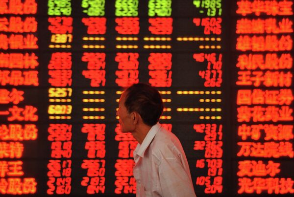 An investor checks stock market prices at a securities firm in Fuyang, in eastern China's Anhui province An investor checks stock market prices at a securities firm in Fuyang, in eastern China's Anhui province - Sputnik International