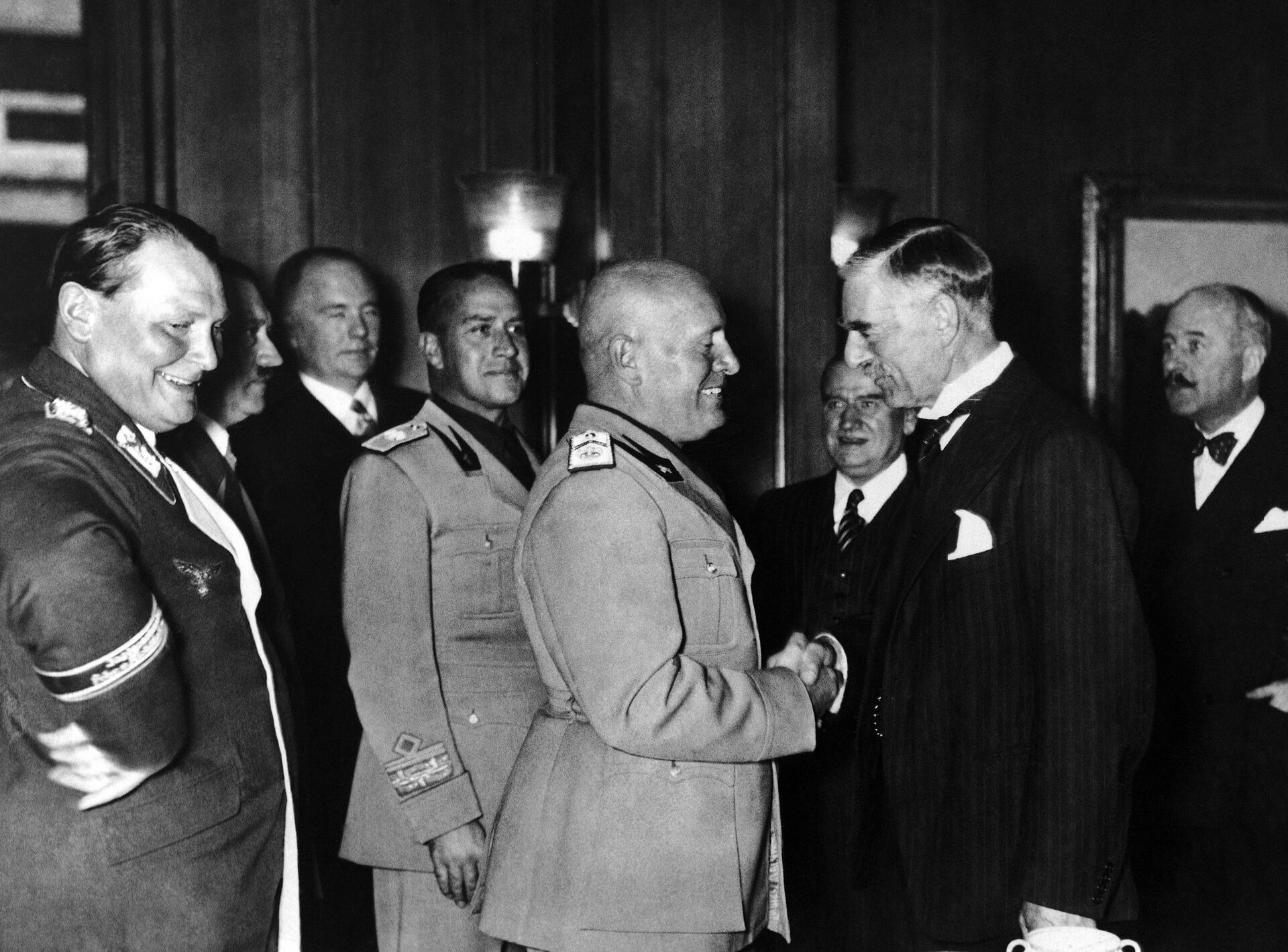 From left to right are: Reichsmarschall and President of the Reichstag Hermann Goering, Italian Foreign Minister Count Ciano and Italian Fascist Leader Benito Mussolini shaking hands with Prime Minister of Great Britain Neville Chamberlain during the Four Power Conference held in autumn 1938 in Munich, Germany. Others not identified - Sputnik International, 1920, 07.05.2023
