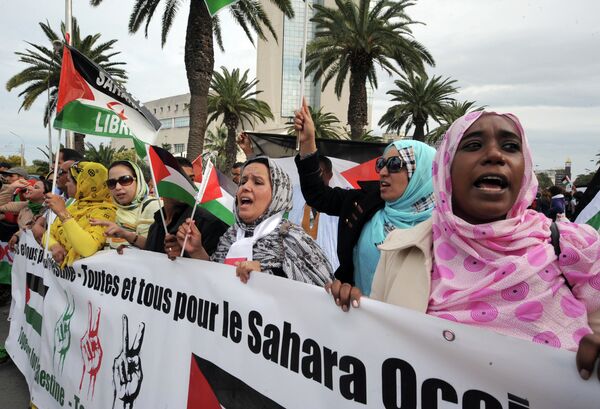 Supporters of the Polisario Front separatist movement hold a banner reading All for Palestine, all for Western Sahara during a demonstration at the closing of the World Social Forum (WSF) in Tunis. (File) Supporters of the Polisario Front separatist movement hold a banner reading All for Palestine, all for Western Sahara during a demonstration at the closing of the World Social Forum (WSF) in Tunis. (File) - Sputnik International