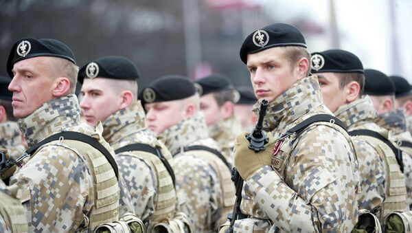 Latvian soldiers stand during a military parade - Sputnik International