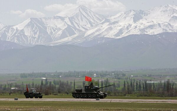 A T-34 tank and a WW II military all-terrain vehicle during preparations for the Victory Parade as part of the military exercises held by the Shanghai Cooperation Organization member states' special forces in the Shamsi gorge, Kyrgyzstan. - Sputnik International