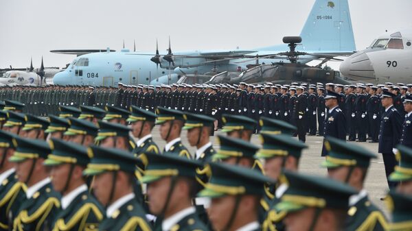 Soldiers are aligned prior to their review ceremony on a runway at the Japan Air Self-Defense Force's Hyakuri air base in Omitama, Ibaraki prefecture - Sputnik International