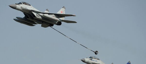 Russian multi-purpose jet fighters MiG-29, left, and MiG-35 perform a demonstration flight at the MAKS-2011 international air show in Zhukovsky near Moscow Russian multi-purpose jet fighters MiG-29, left, and MiG-35 perform a demonstration flight at the MAKS-2011 international air show in Zhukovsky near Moscow - Sputnik International